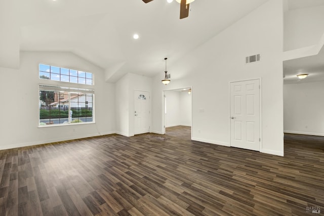 unfurnished living room with dark wood-style floors, baseboards, visible vents, high vaulted ceiling, and ceiling fan