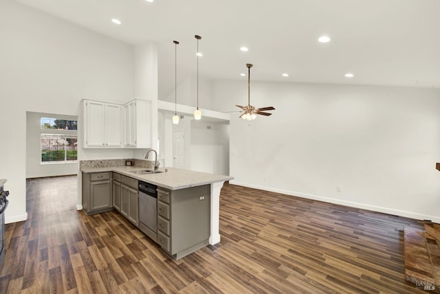 kitchen featuring gray cabinetry, open floor plan, dishwasher, a peninsula, and a sink