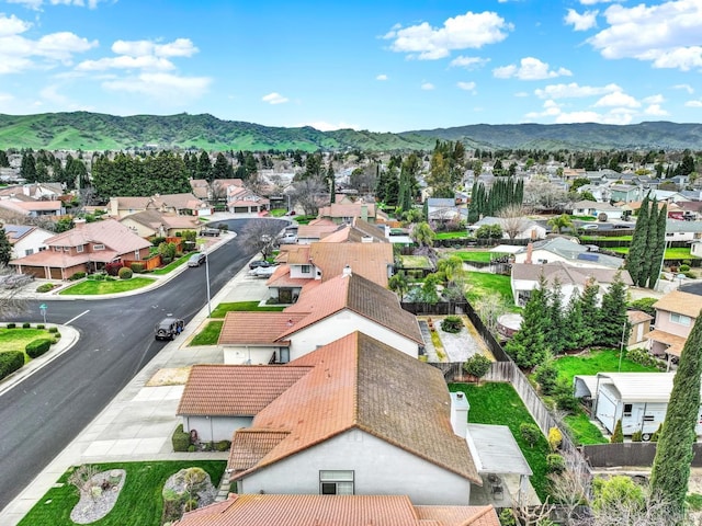 drone / aerial view featuring a residential view and a mountain view