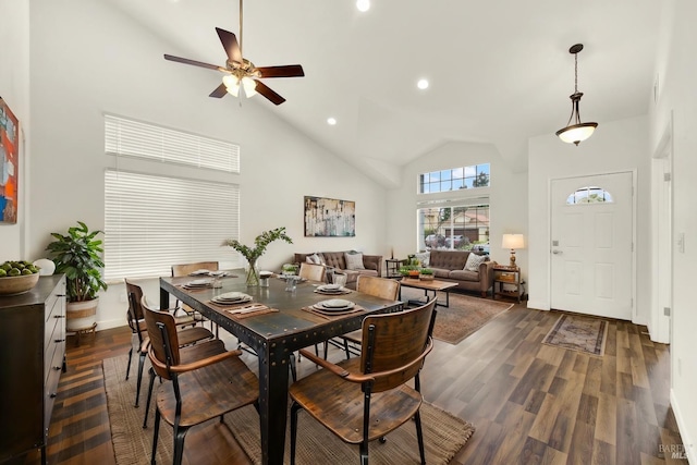 dining room featuring baseboards, high vaulted ceiling, recessed lighting, ceiling fan, and dark wood-type flooring