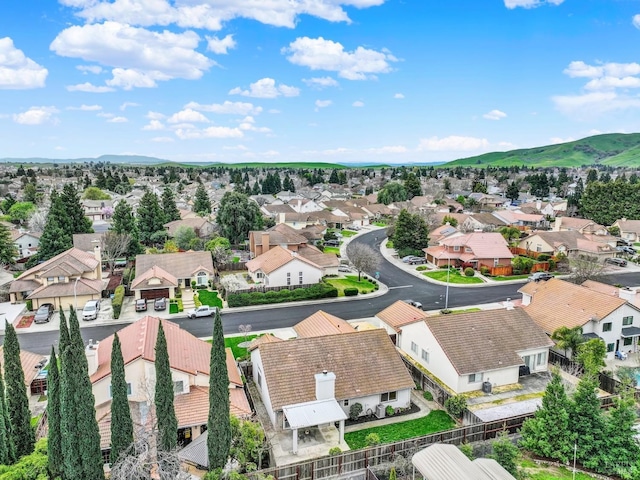 aerial view featuring a mountain view and a residential view