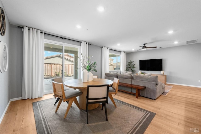 dining space featuring light wood finished floors, visible vents, recessed lighting, and baseboards