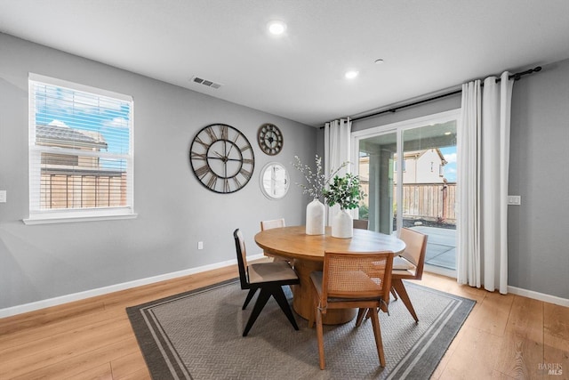 dining space with recessed lighting, visible vents, baseboards, and light wood finished floors