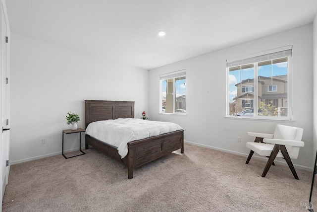 bedroom featuring baseboards and carpet floors