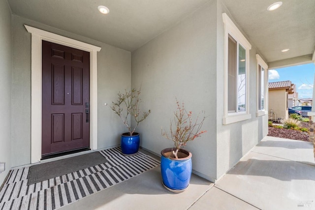 property entrance featuring stucco siding