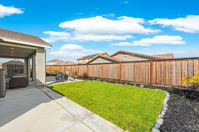 view of yard with a patio and a fenced backyard