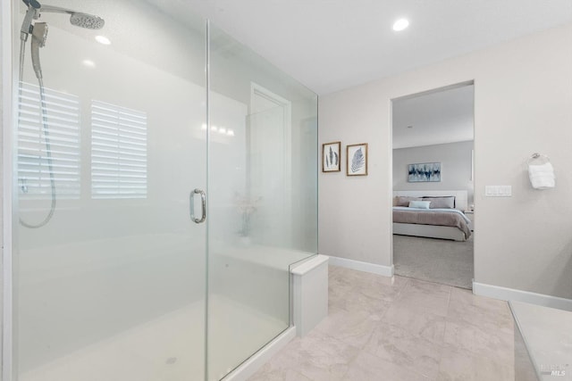 ensuite bathroom featuring a stall shower, recessed lighting, baseboards, and ensuite bathroom