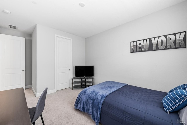 bedroom featuring carpet floors, visible vents, and baseboards