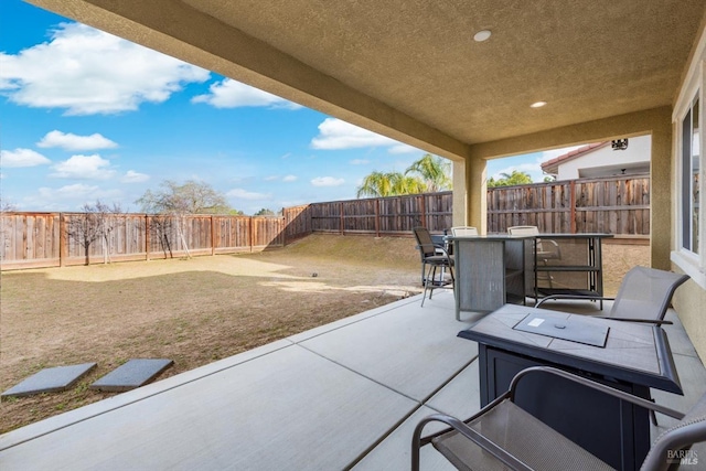 view of patio featuring outdoor dining space and a fenced backyard