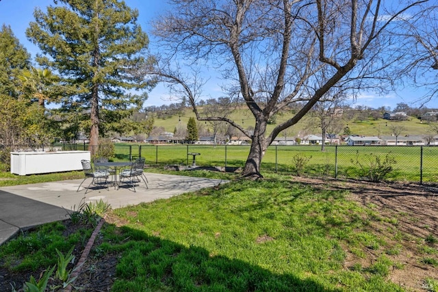 view of yard featuring a patio area and fence