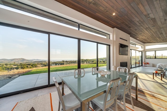 3400 Atlas Peak Rd, Napa, CA 94558 - sunroom / solarium featuring a mountain view, a fireplace, and wood ceiling