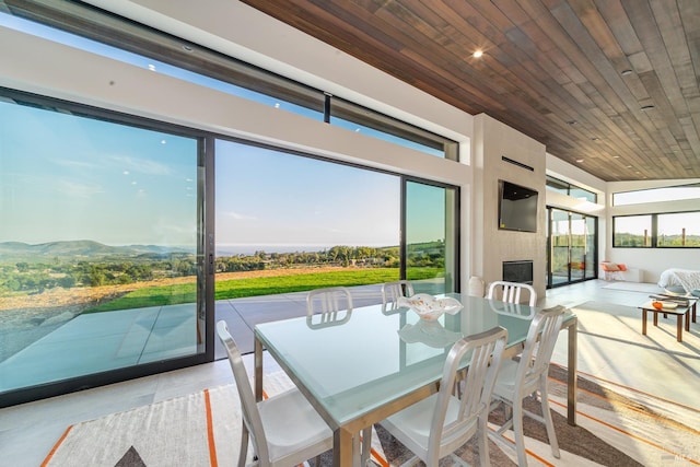 3400 Atlas Peak Rd, Napa, CA 94558 - sunroom with wooden ceiling, a fireplace, and a mountain view