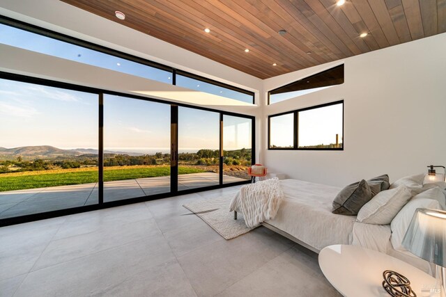 3400 Atlas Peak Rd, Napa, CA 94558 - unfurnished bedroom featuring access to exterior, recessed lighting, wood ceiling, and finished concrete floors