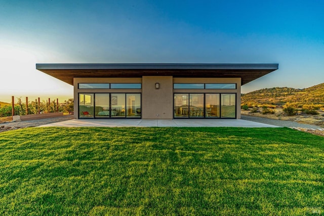 3400 Atlas Peak Rd, Napa, CA 94558 - rear view of house featuring a mountain view, a lawn, and stucco siding