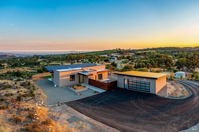 3400 Atlas Peak Rd, Napa, CA 94558 - view of front of home with metal roof, driveway, and stucco siding
