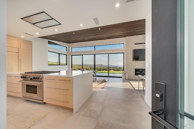 3400 Atlas Peak Rd, Napa, CA 94558 - kitchen with light brown cabinets, recessed lighting, open floor plan, high end stainless steel range oven, and modern cabinets