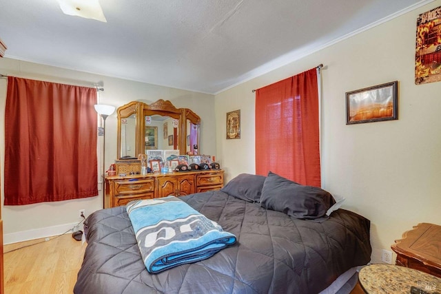 bedroom with wood finished floors