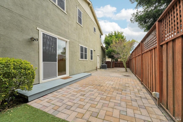 view of patio featuring central AC unit and a fenced backyard