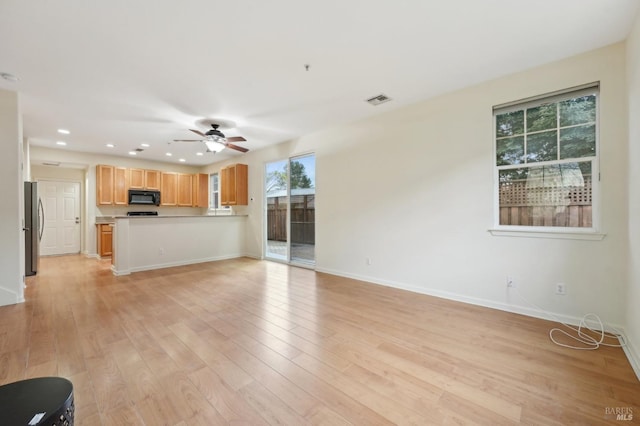 unfurnished living room featuring ceiling fan, recessed lighting, visible vents, baseboards, and light wood-type flooring