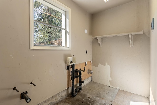 clothes washing area with laundry area, washer hookup, and hookup for an electric dryer