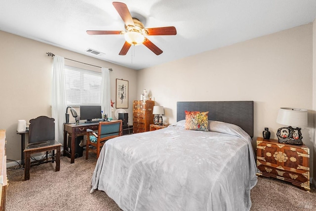 carpeted bedroom featuring visible vents and ceiling fan