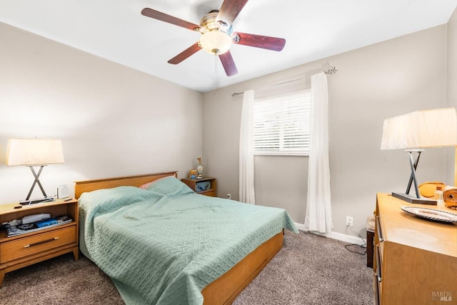 carpeted bedroom featuring ceiling fan and baseboards