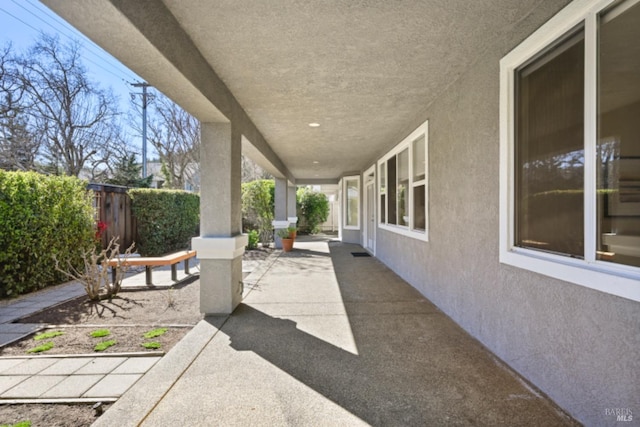 view of patio featuring fence
