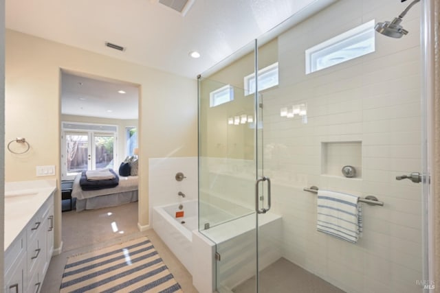 ensuite bathroom with ensuite bathroom, a garden tub, recessed lighting, vanity, and a shower stall