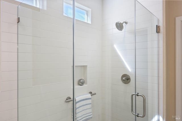 full bath featuring a shower stall