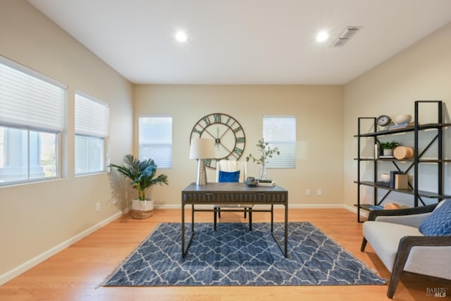 office with baseboards, visible vents, wood finished floors, and recessed lighting