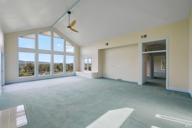 unfurnished living room with visible vents, carpet flooring, ceiling fan, a mountain view, and high vaulted ceiling