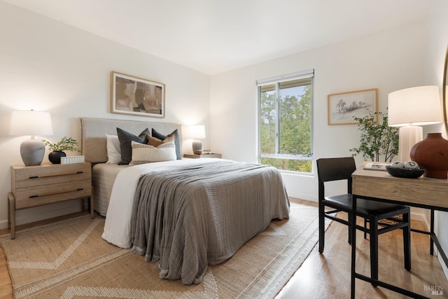 bedroom with light wood-style floors