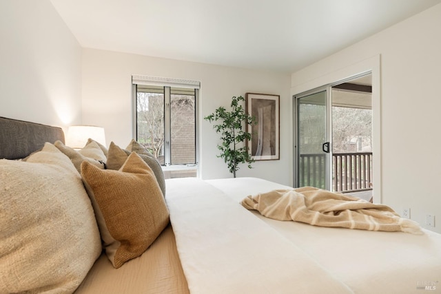 bedroom featuring access to outside and multiple windows