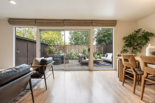 interior space with plenty of natural light, wood finished floors, and recessed lighting