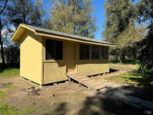 view of side of home with an outbuilding