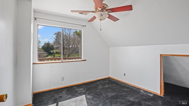 bonus room featuring visible vents, carpet floors, baseboards, ceiling fan, and vaulted ceiling