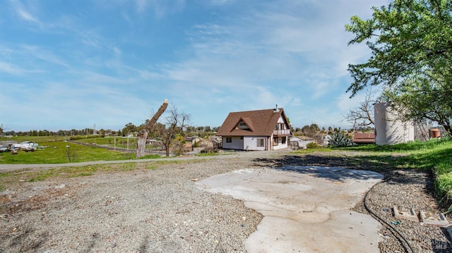 view of side of home with driveway