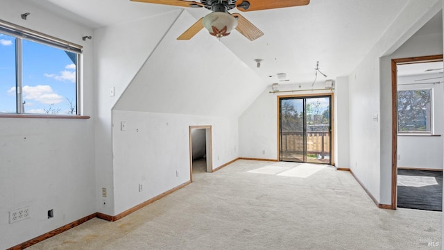 additional living space with a ceiling fan, lofted ceiling, carpet, and baseboards