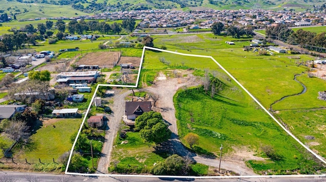 birds eye view of property featuring a rural view