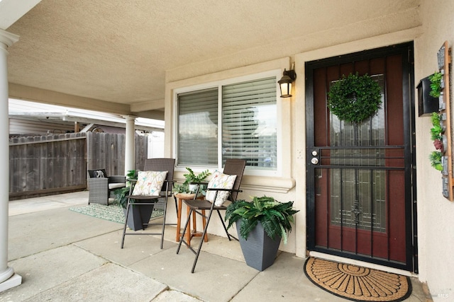 doorway to property with fence