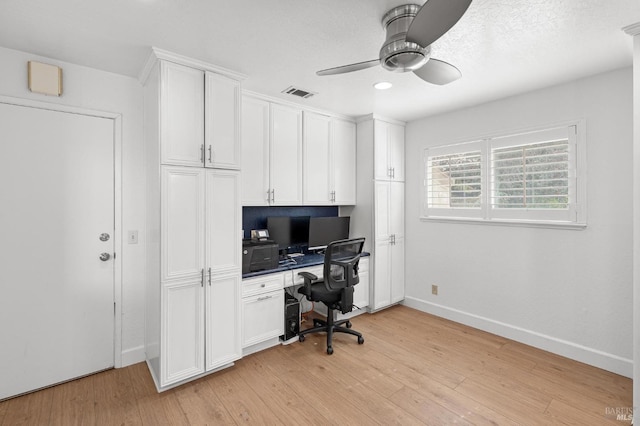 home office with ceiling fan, baseboards, visible vents, and light wood-style floors