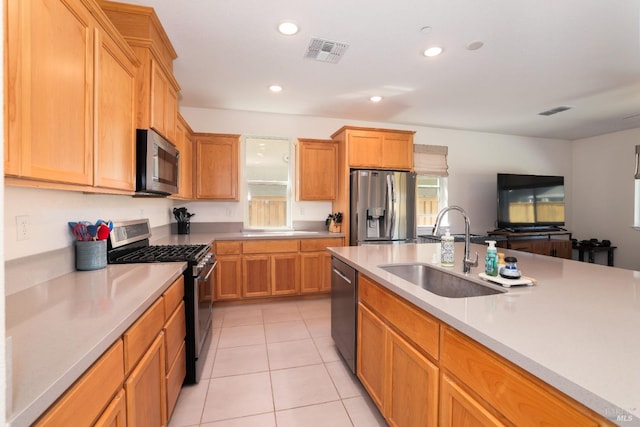 kitchen with visible vents, light countertops, recessed lighting, appliances with stainless steel finishes, and a sink