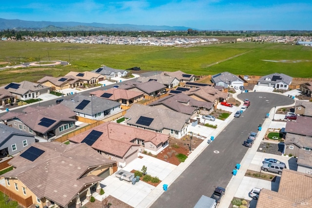 drone / aerial view with a mountain view and a residential view