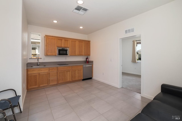 kitchen with a sink, visible vents, appliances with stainless steel finishes, and recessed lighting