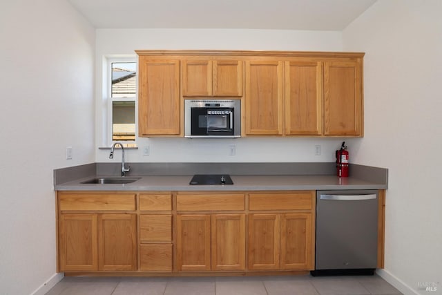 kitchen with a sink, baseboards, dishwasher, and brown cabinets