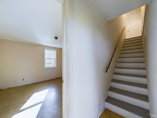 stairs featuring tile patterned floors