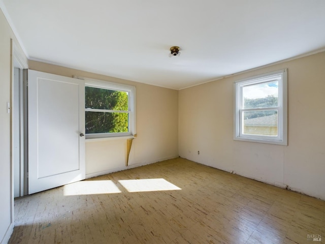 unfurnished room featuring plenty of natural light