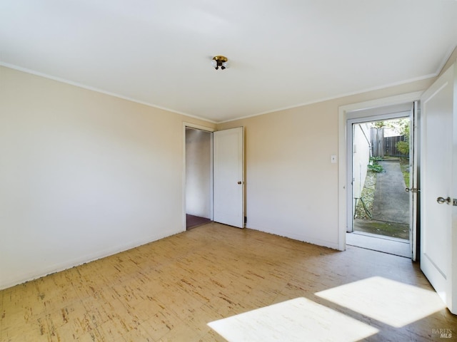 empty room featuring ornamental molding