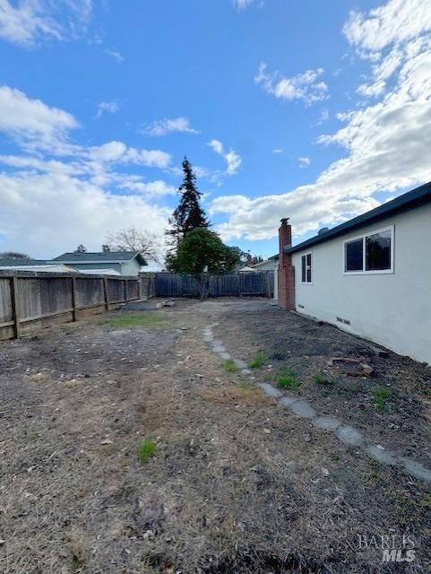 view of yard with a fenced backyard