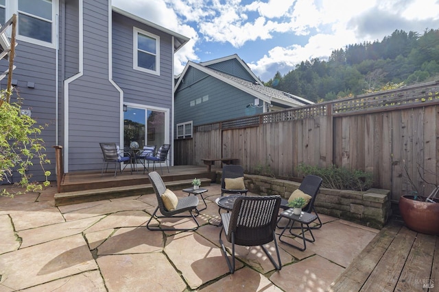 8 June Ct, Fairfax, CA 94930 - fenced backyard featuring a wooden deck and a patio area